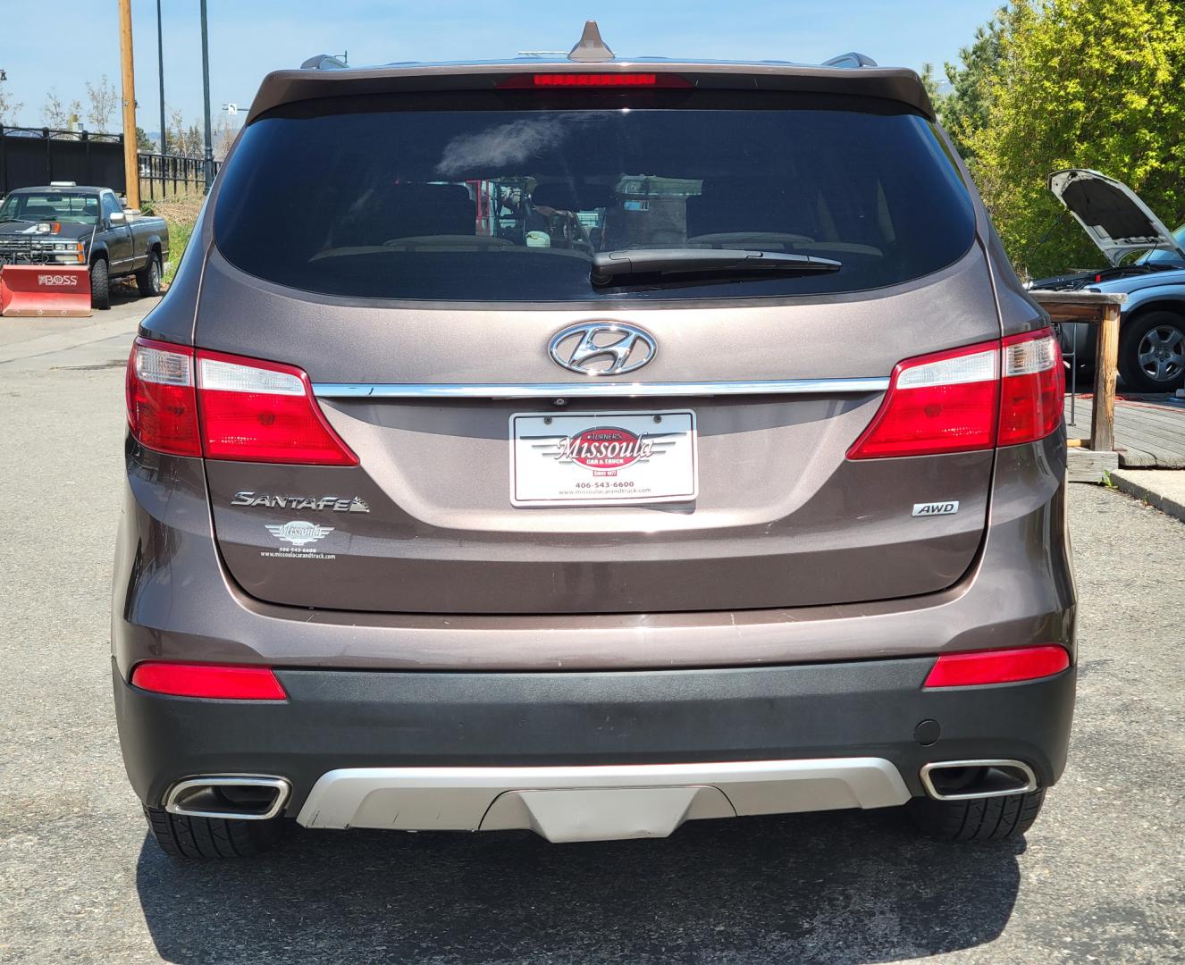 2015 Brown /Tan Hyundai Santa Fe GLS (KM8SMDHF7FU) with an 3.3L V6 engine, 6 Speed Auto transmission, located at 450 N Russell, Missoula, MT, 59801, (406) 543-6600, 46.874496, -114.017433 - Great Running AWD SUV. 3.3L V6 Engine. 6 Speed Automatic Transmission. 3rd Row Seating. Heated Front Seats. Power Drivers Seat. Backup Camera. AM FM XM CD. Bluetooth. Newer Continental Tires from Les Schwab. New Brakes. Air. Cruise. Tilt. Power Windows and Locks. - Photo#4